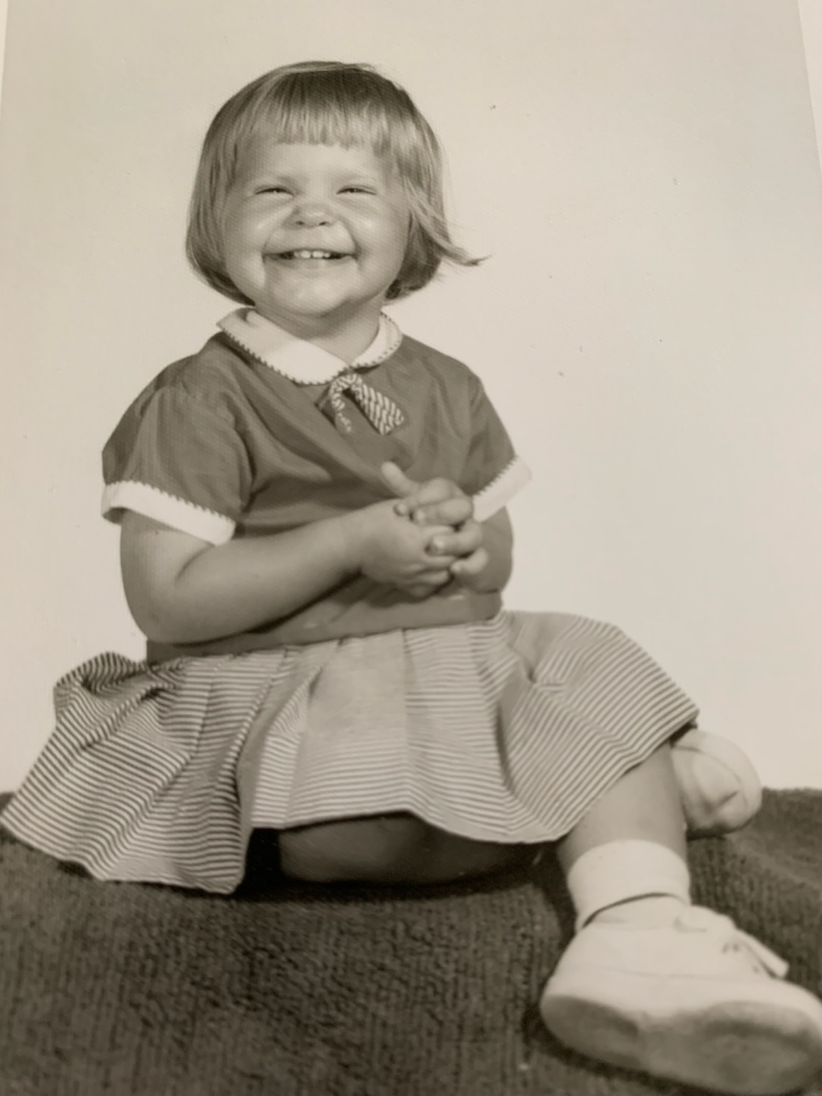 A sepia tone picture of a little girl